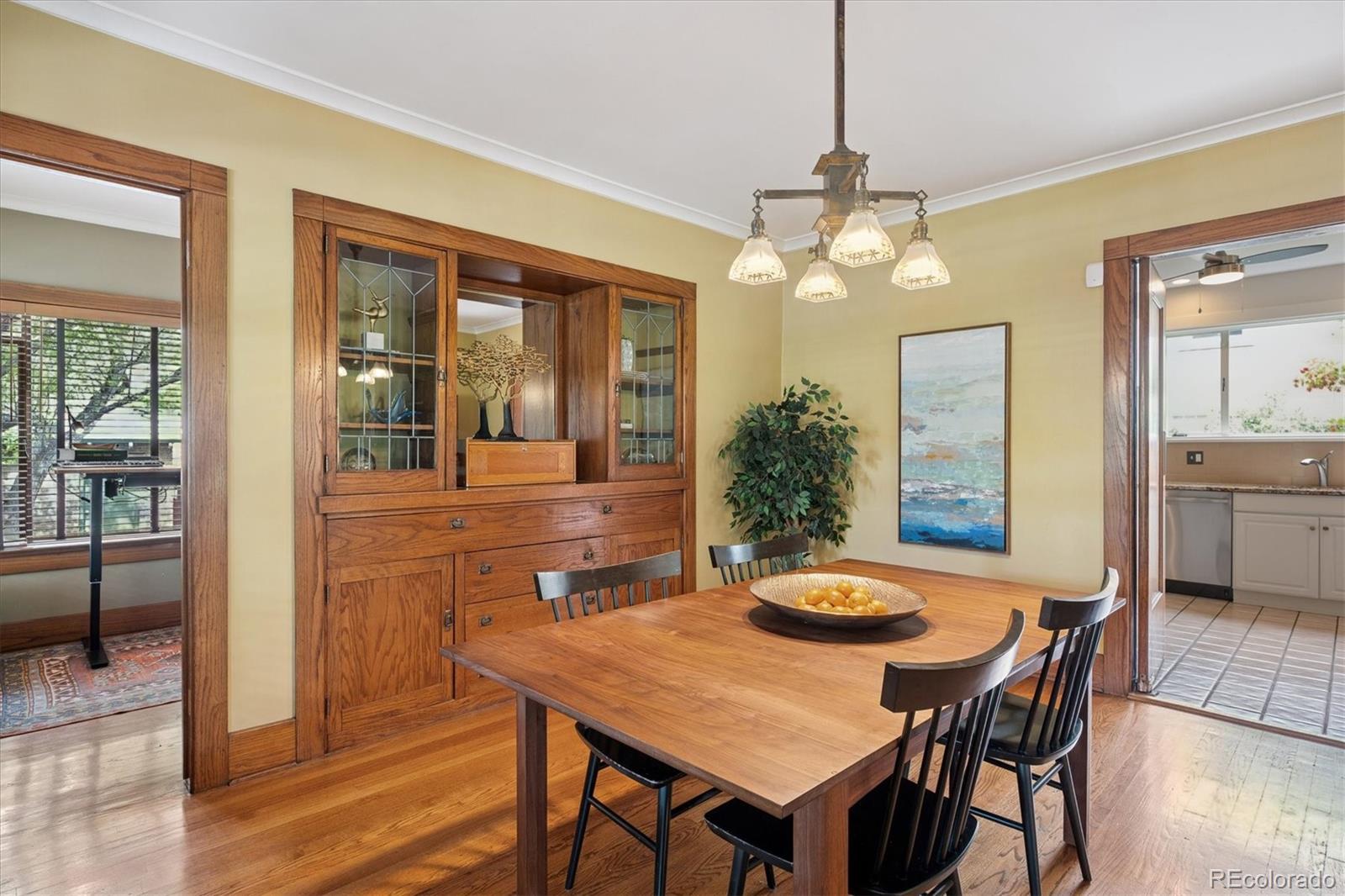 2201 Cherry Street Denver, CO 80207 - Photo 12 of 46 a view of a dining room with furniture window and wooden floor