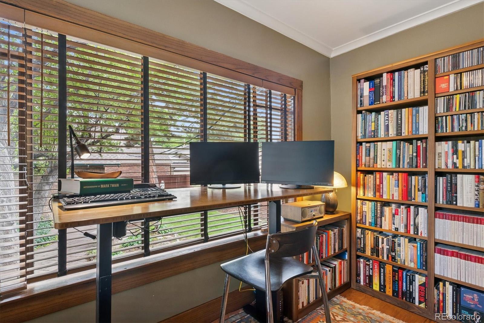 2201 Cherry Street Denver, CO 80207 - Photo 14 of 46 a reading room with furniture and a book shelf