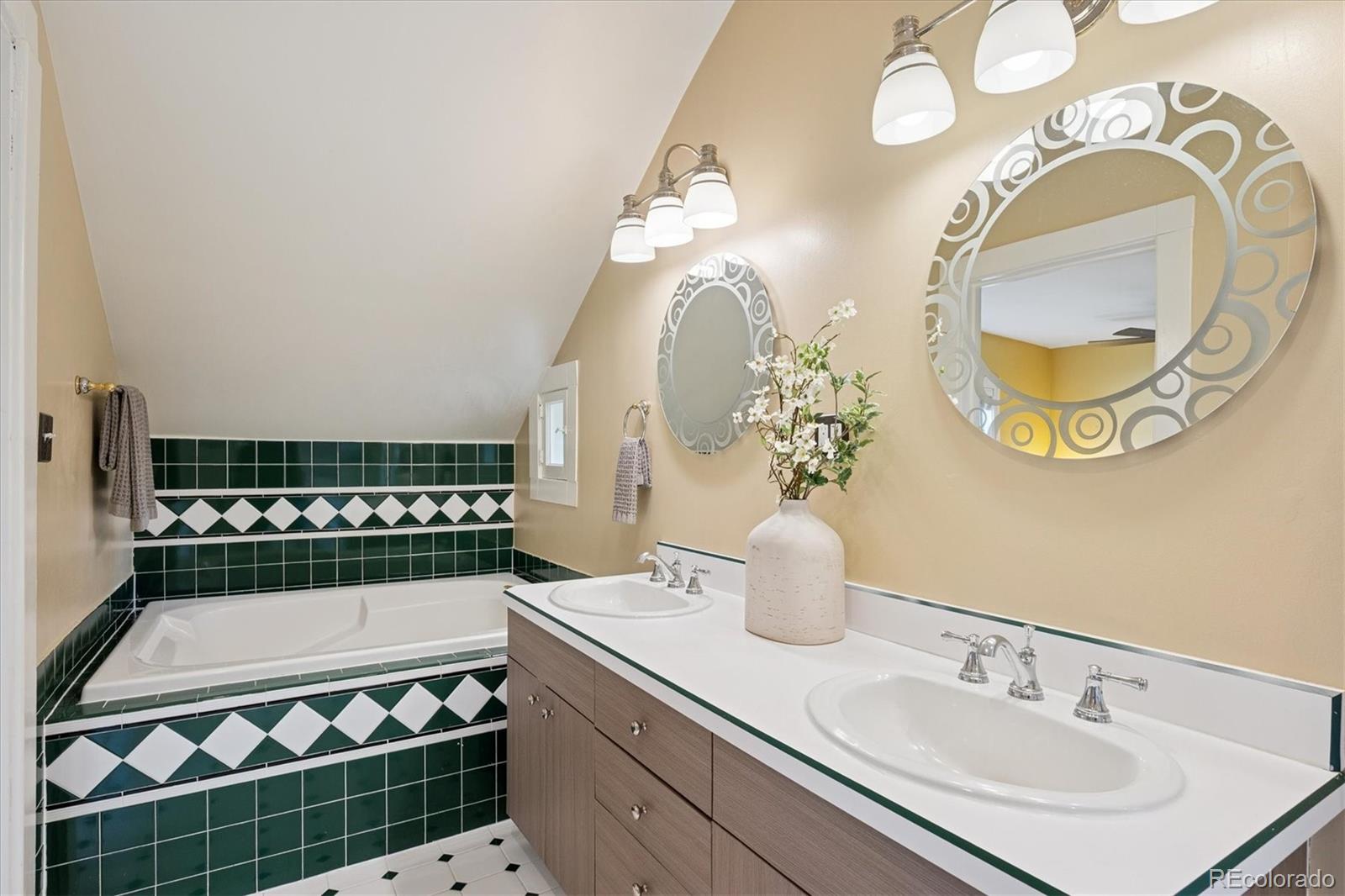 2201 Cherry Street Denver, CO 80207 - Photo 21 of 46 a bathroom with a sink and a mirror