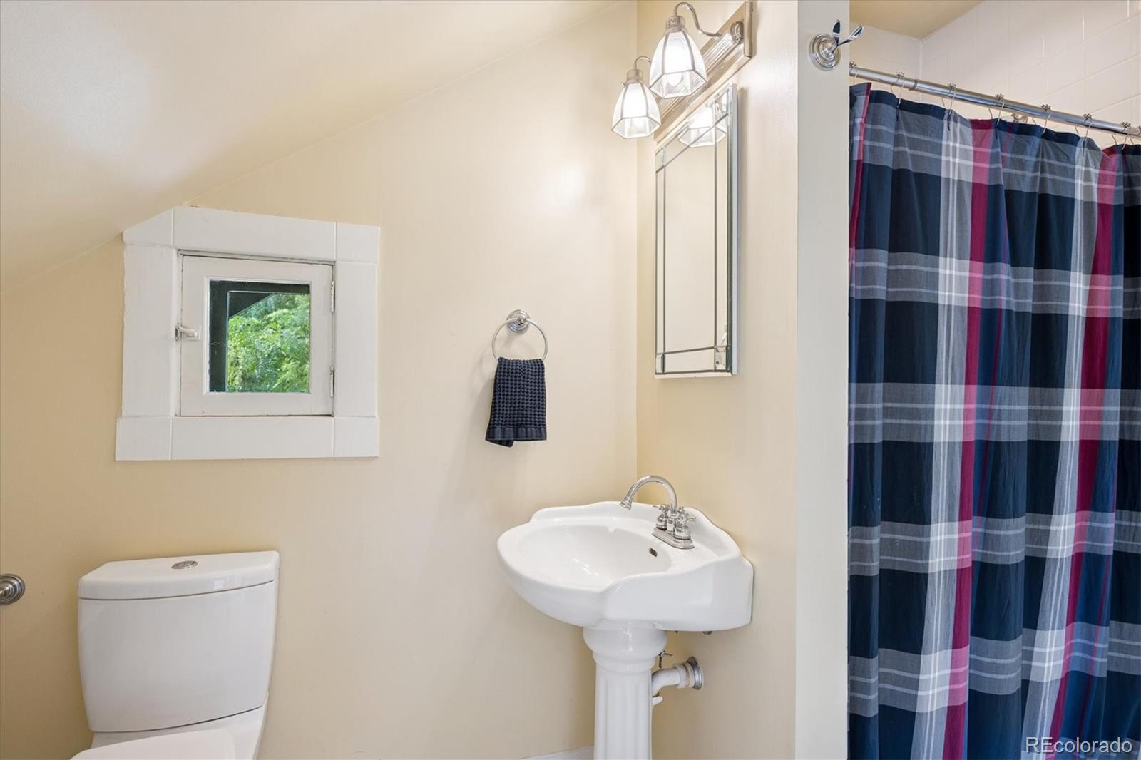 2201 Cherry Street Denver, CO 80207 - Photo 27 of 46 a bathroom with a sink toilet and shower