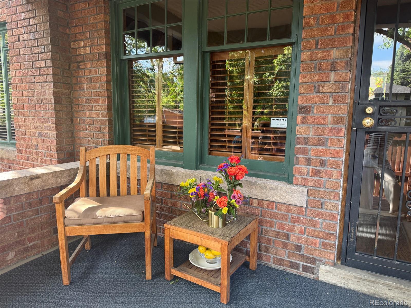 2201 Cherry Street Denver, CO 80207 - Photo 3 of 46 a outdoor living space with furniture and a potted plant