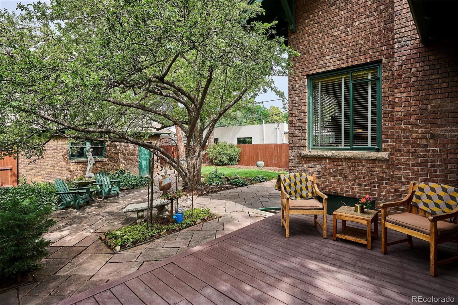 2201 Cherry Street Denver, CO 80207 - Photo 34 of 46 a view of a bench in a backyard