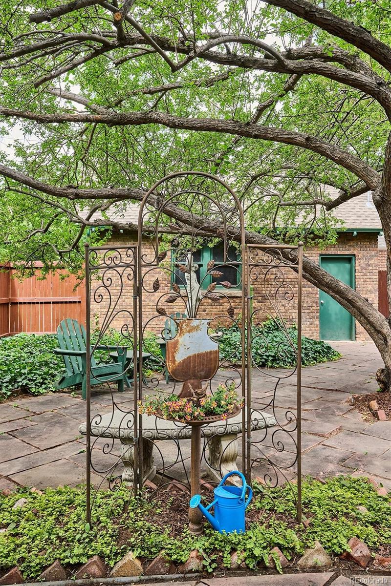 2201 Cherry Street Denver, CO 80207 - Photo 35 of 46 a view of a chairs and table in backyard