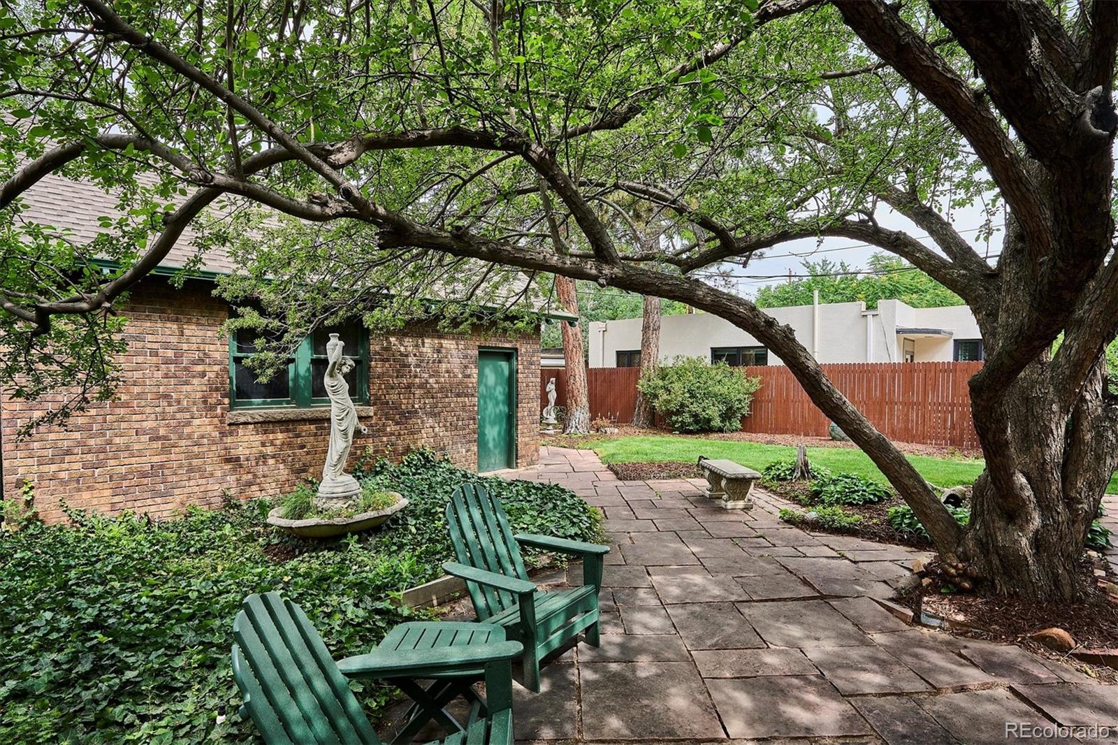 2201 Cherry Street Denver, CO 80207 - Photo 40 of 46 a backyard of a house with lots of green space