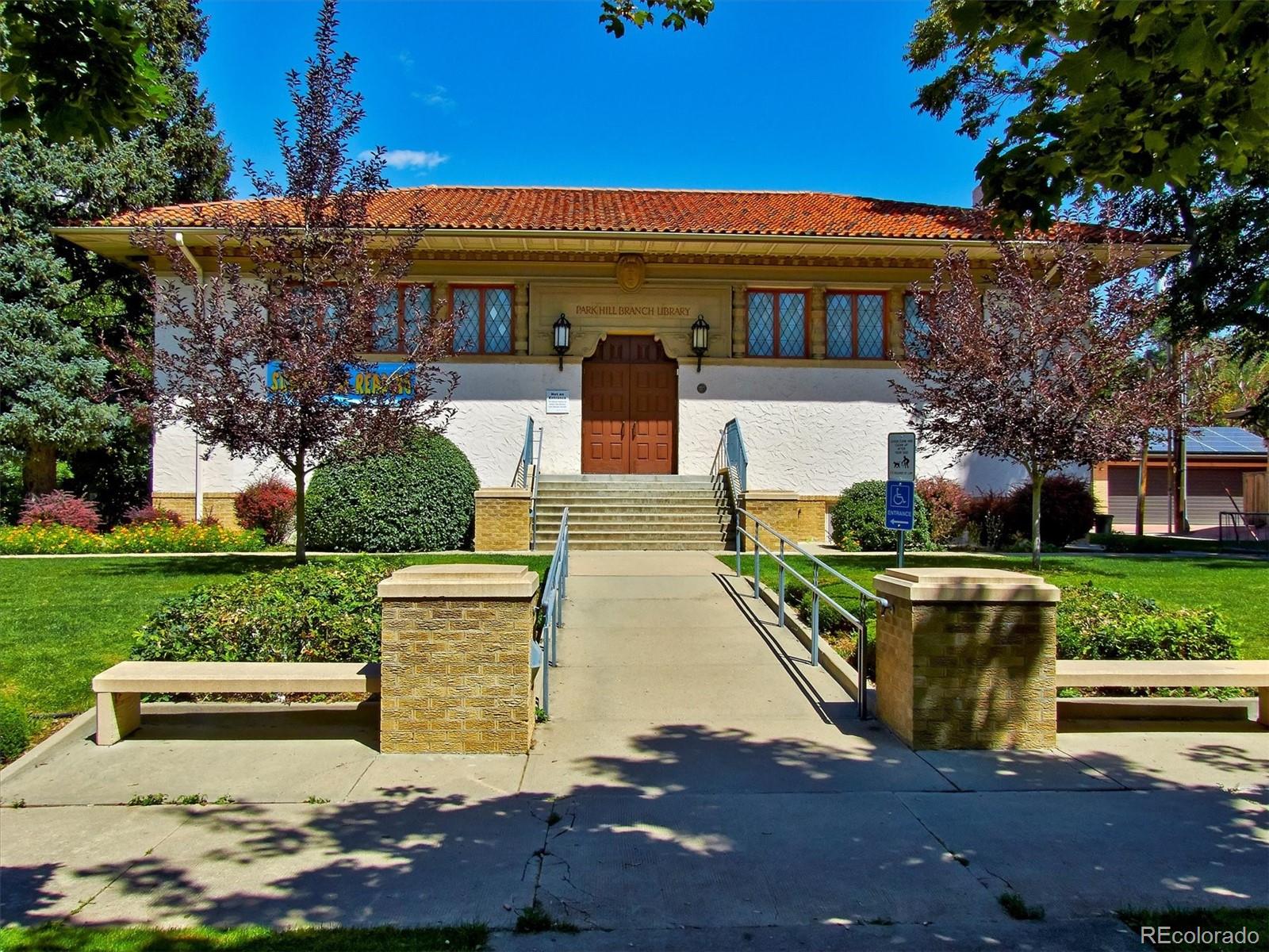 2201 Cherry Street Denver, CO 80207 - Photo 45 of 46 a front view of a house with garden and sitting area