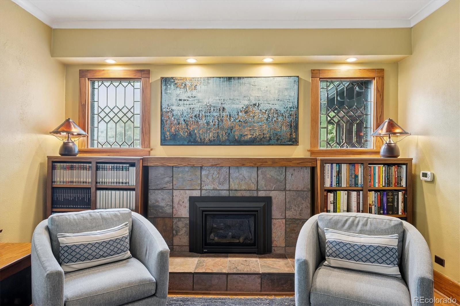 2201 Cherry Street Denver, CO 80207 - Photo 6 of 46 a living room with furniture and a fireplace