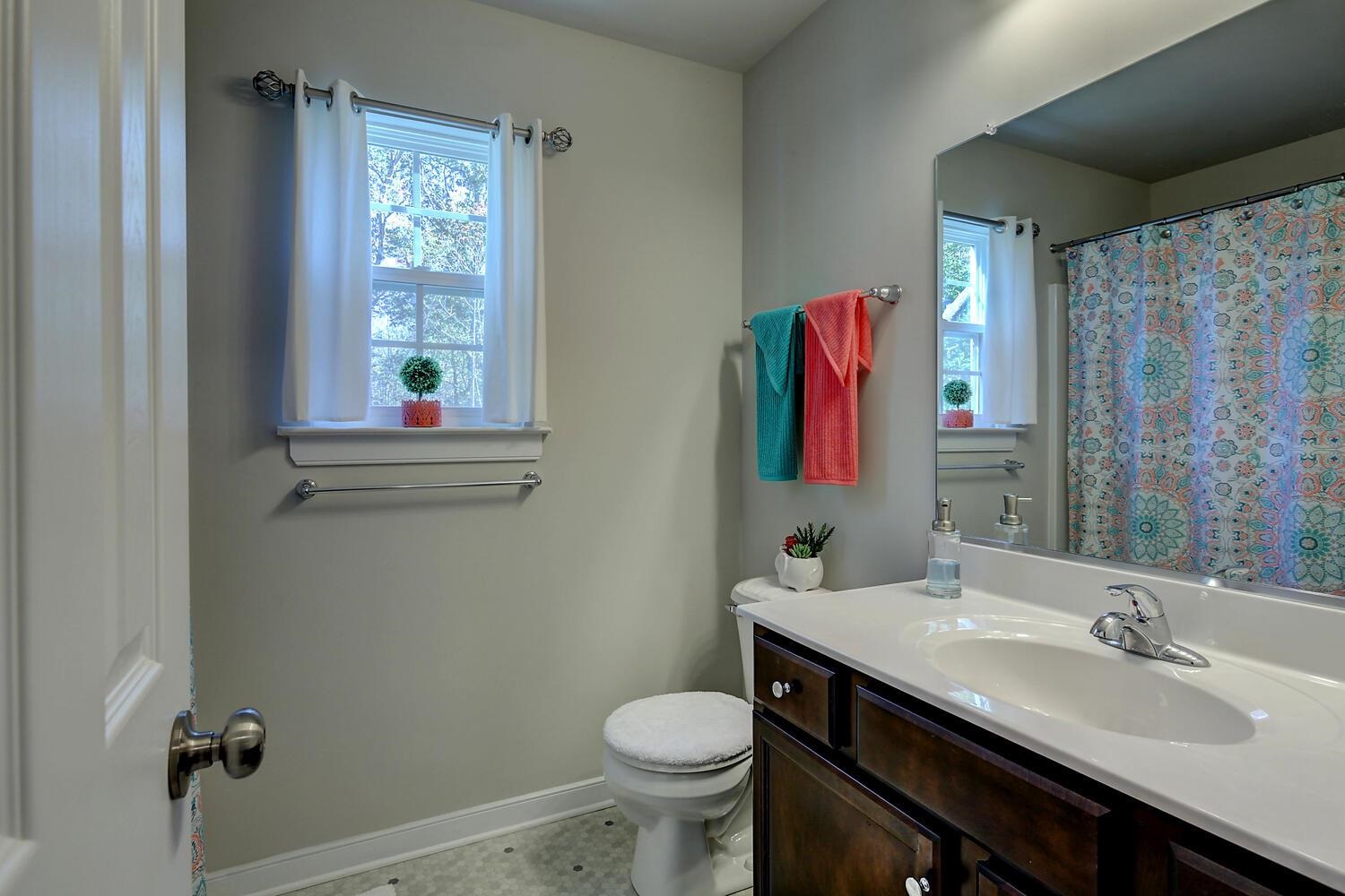 6144 Courthouse Road Louisa, VA 23093 - Photo 17 of 23 a bathroom with a sink toilet and mirror