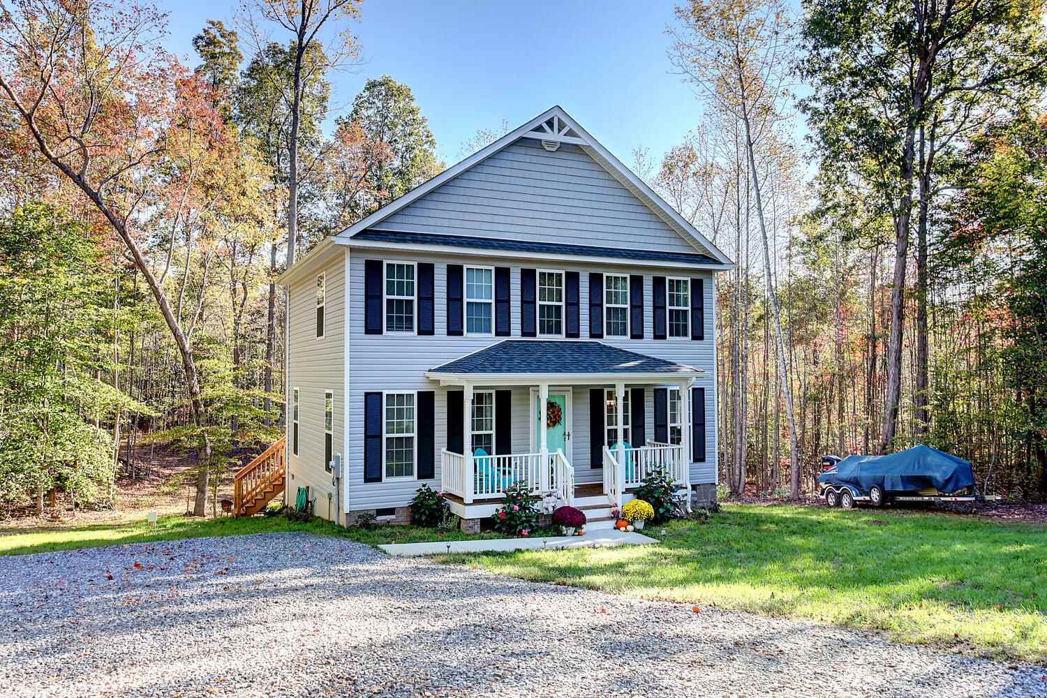 6144 Courthouse Road Louisa, VA 23093 - Photo 20 of 23 a front view of a house with garden and trees