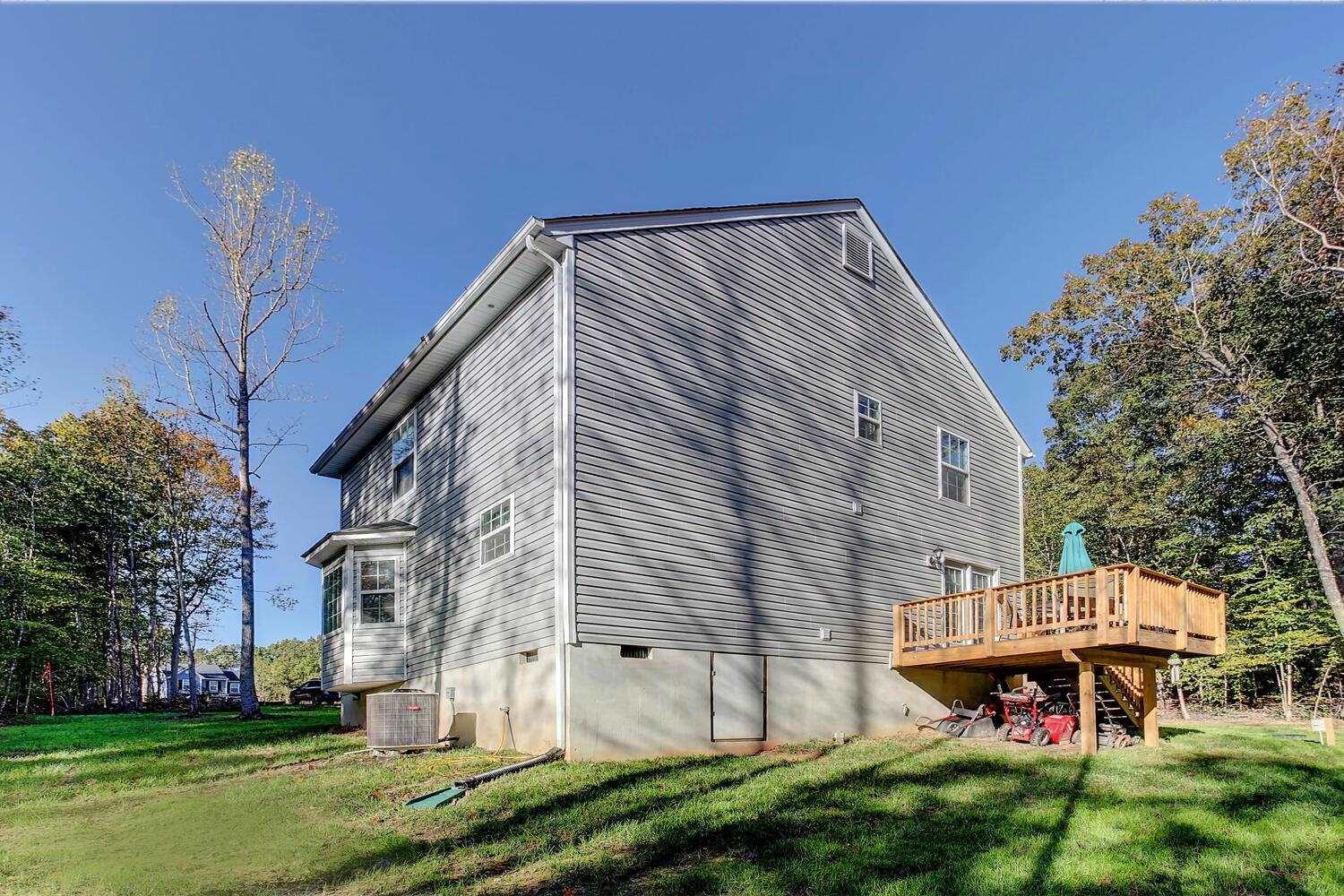 6144 Courthouse Road Louisa, VA 23093 - Photo 22 of 23 a backyard of a house with table and chairs