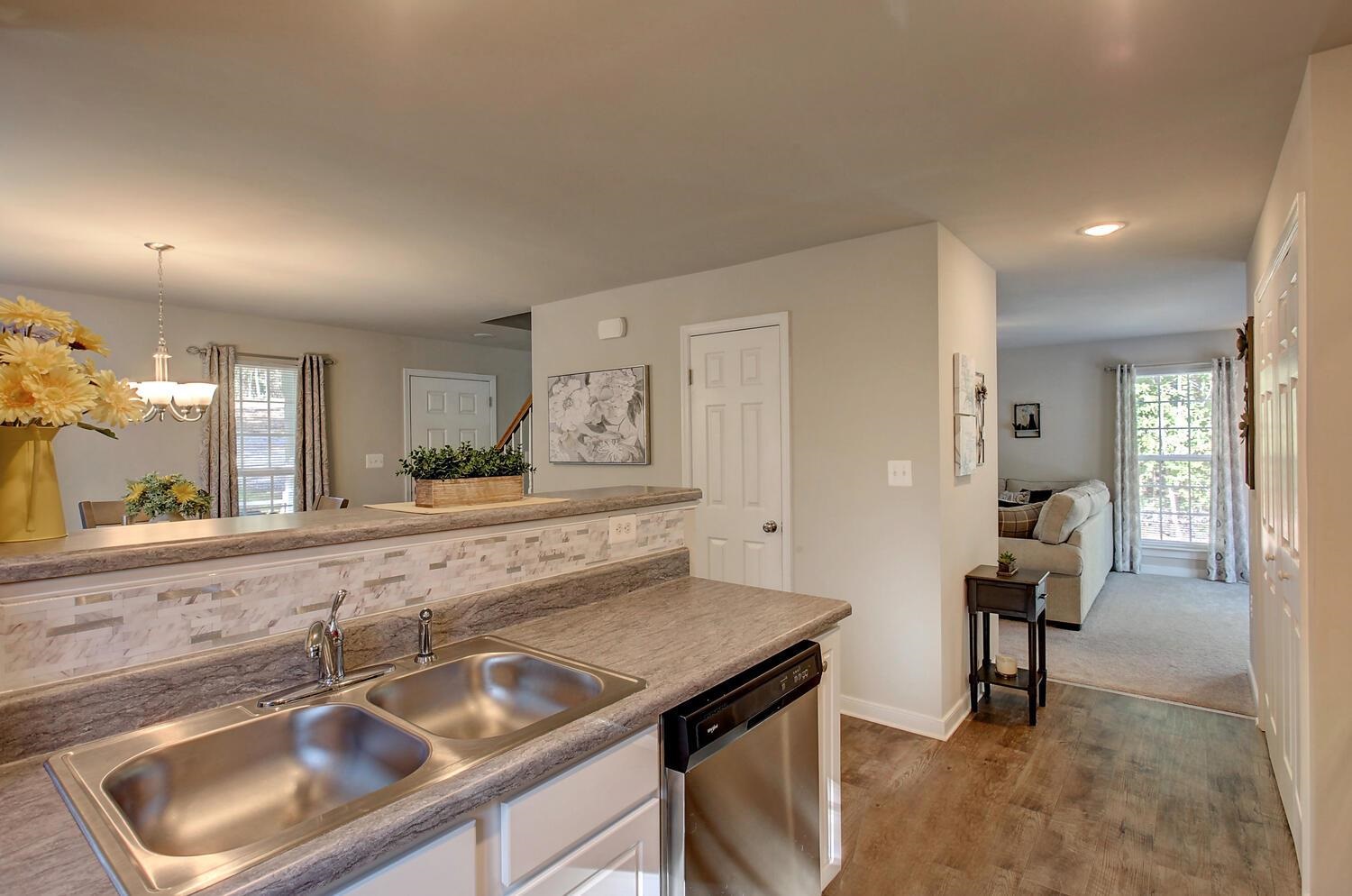 6144 Courthouse Road Louisa, VA 23093 - Photo 9 of 23 a kitchen with a sink and chairs