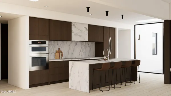 a kitchen with kitchen island a counter top space cabinets and stainless steel appliances