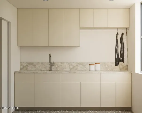 a kitchen with a sink and cabinets