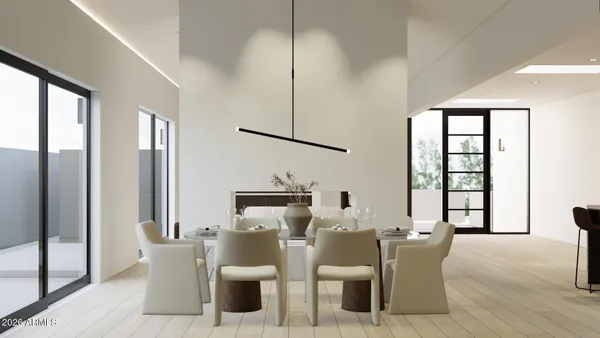 a living room with furniture a lamp and a large window