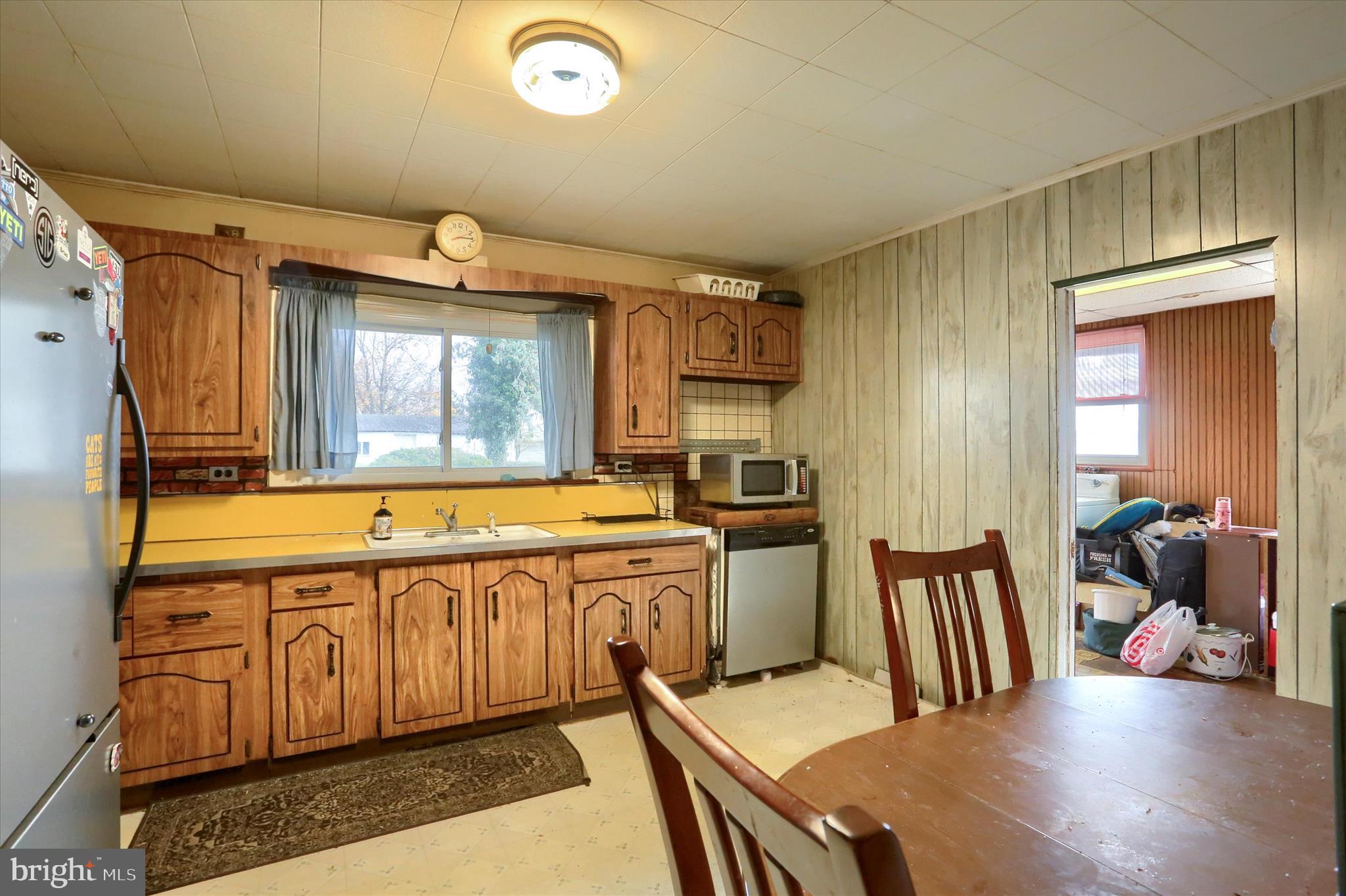 1110 Main Street Harrisburg, PA 17113 - Photo 13 of 37 a kitchen with a sink and chairs