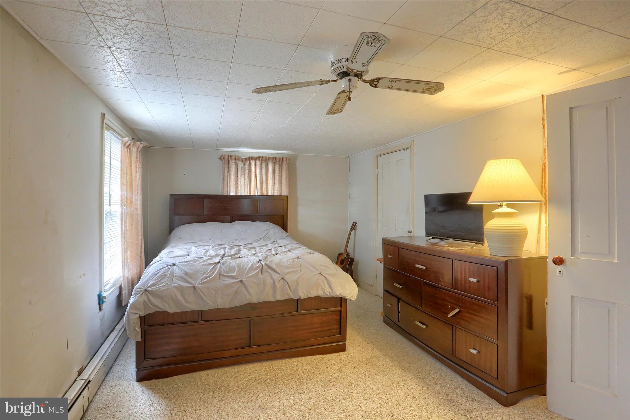 1110 Main Street Harrisburg, PA 17113 - Photo 18 of 37 a bedroom with a bed and a chandelier