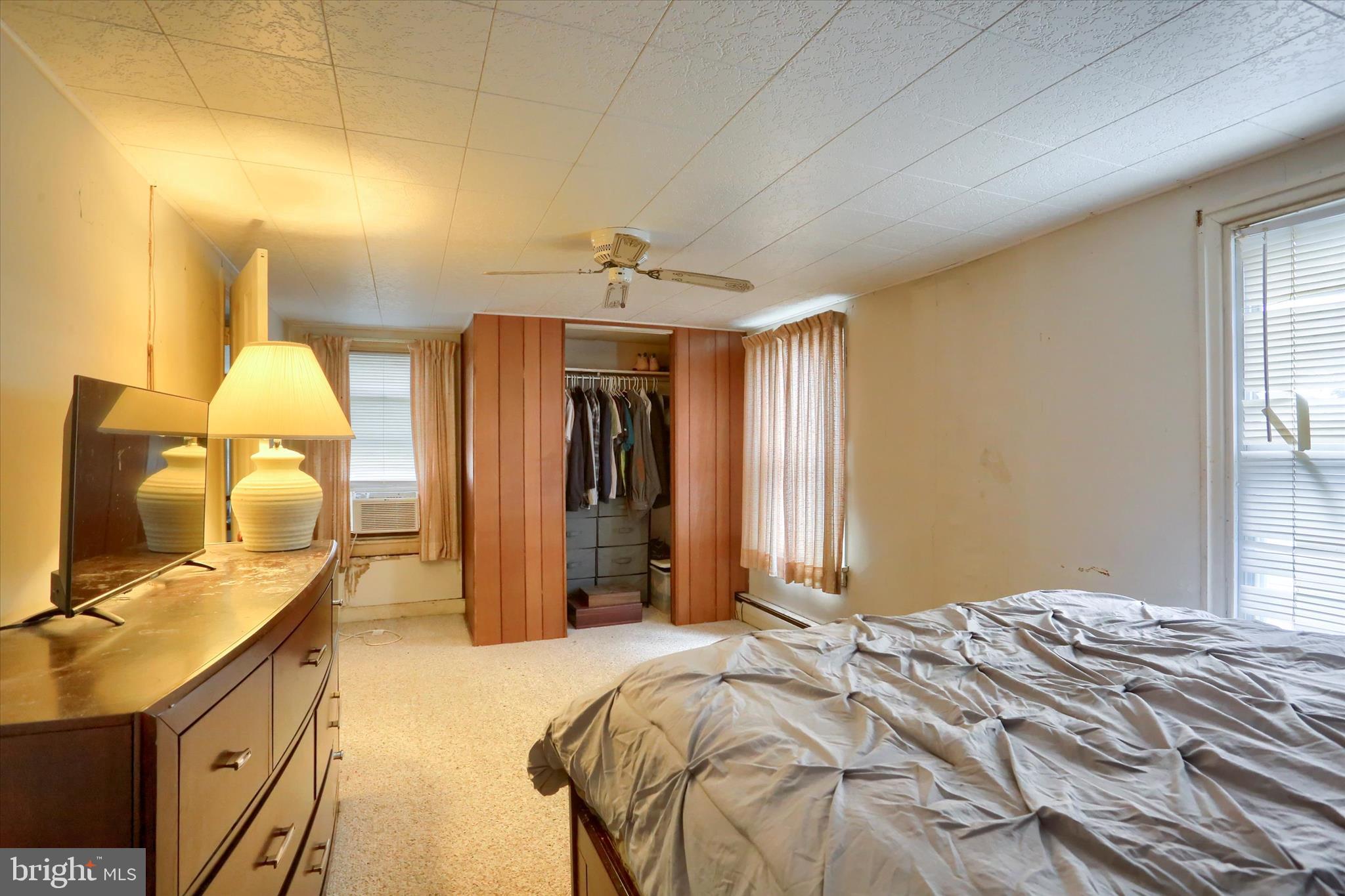 1110 Main Street Harrisburg, PA 17113 - Photo 19 of 37 a bedroom with a bed a flat screen tv and dresser