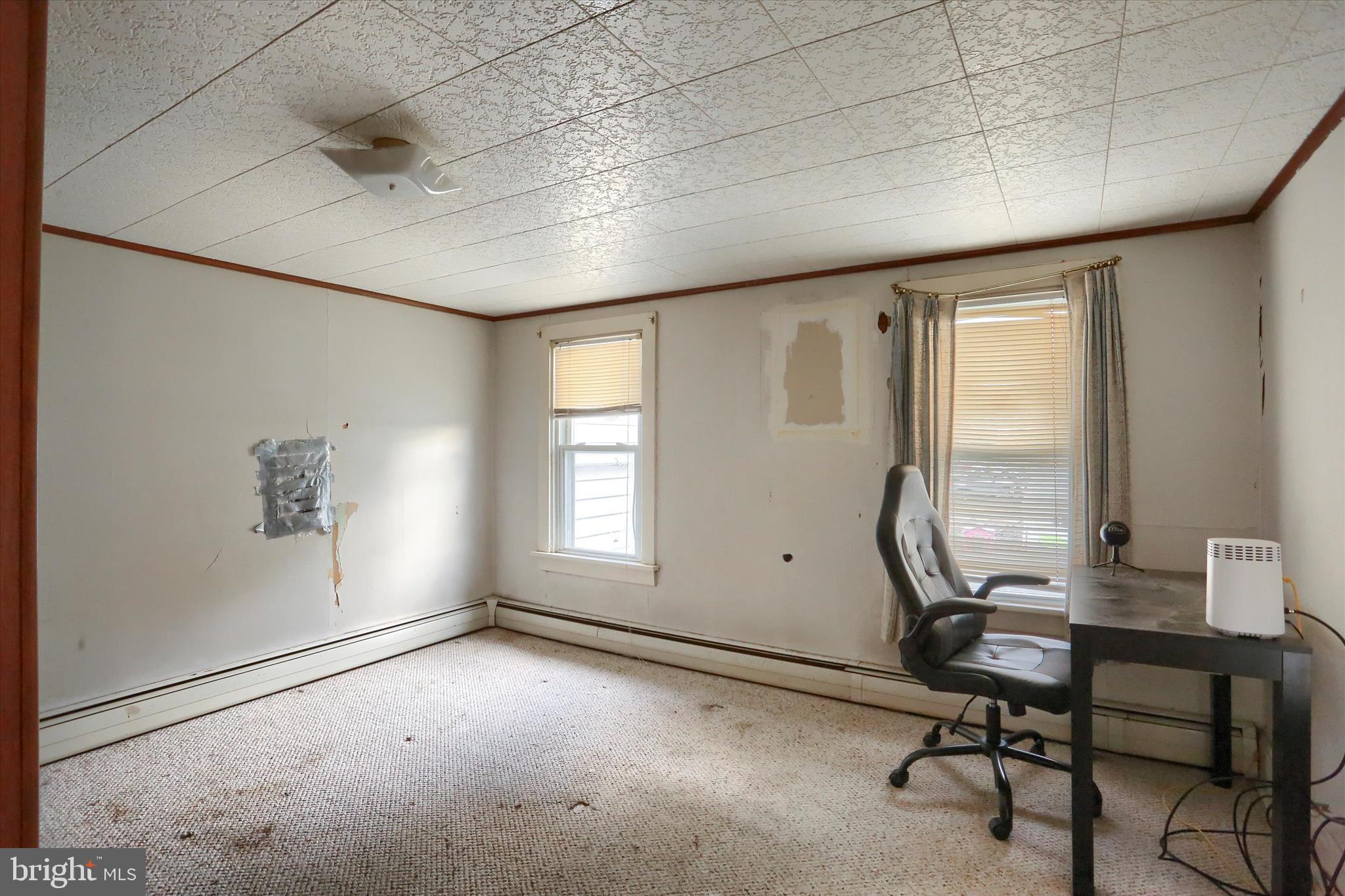 1110 Main Street Harrisburg, PA 17113 - Photo 20 of 37 a view of a workspace with furniture and a window
