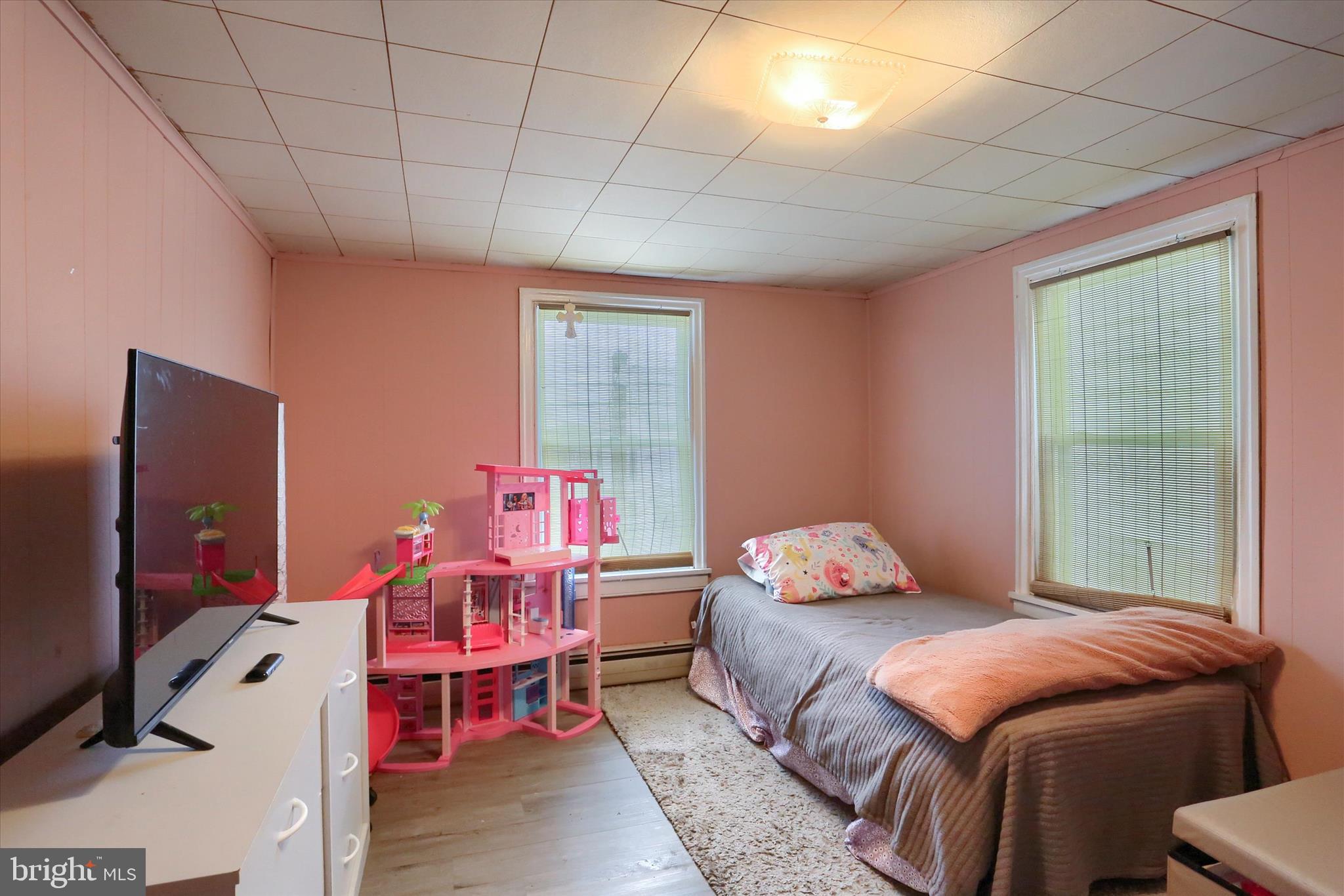 1110 Main Street Harrisburg, PA 17113 - Photo 22 of 37 a bedroom with a bed and wooden floor