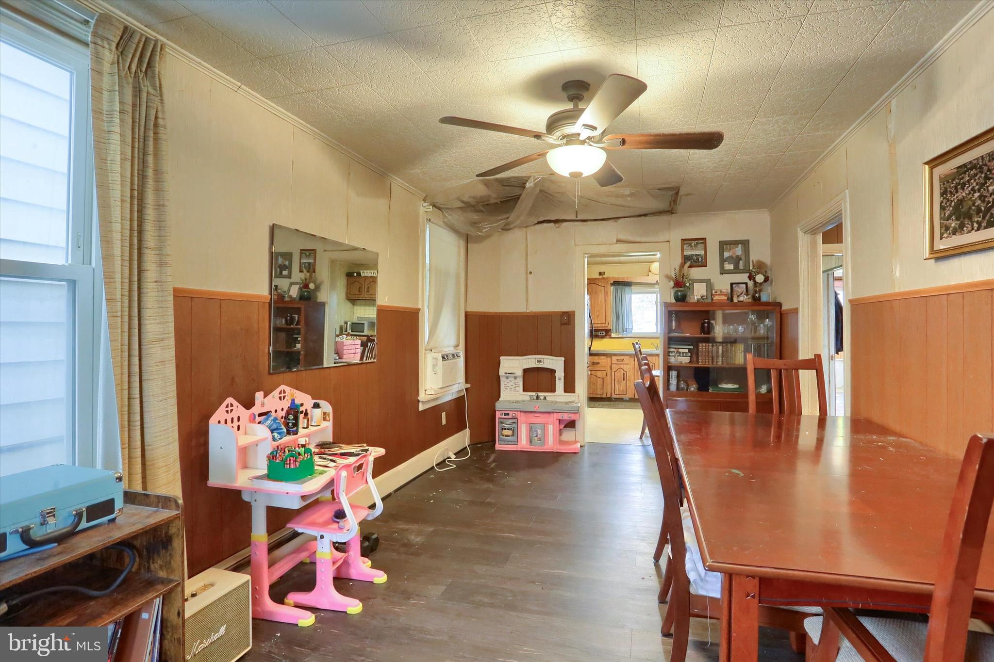 1110 Main Street Harrisburg, PA 17113 - Photo 9 of 37 a dining room with furniture potted plants and wooden floor
