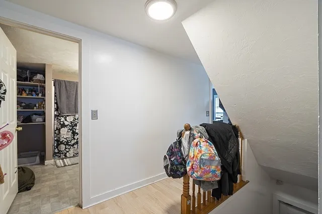 a kitchen with a stove refrigerator and couch