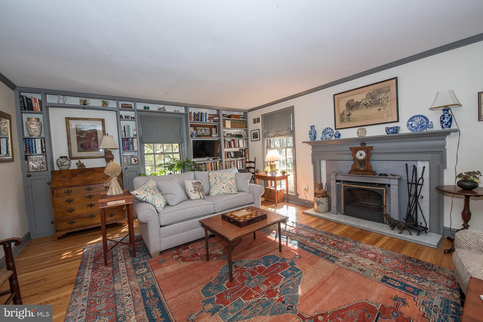 35 South Providence Road Wallingford, PA 19086 - Photo 8 of 71 a living room with furniture and a fireplace