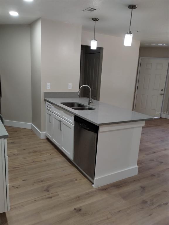 623 Dory Lane, Unit 306 Altamonte Springs, FL 32714 - Photo 14 of 21 a kitchen with a sink and wooden floor