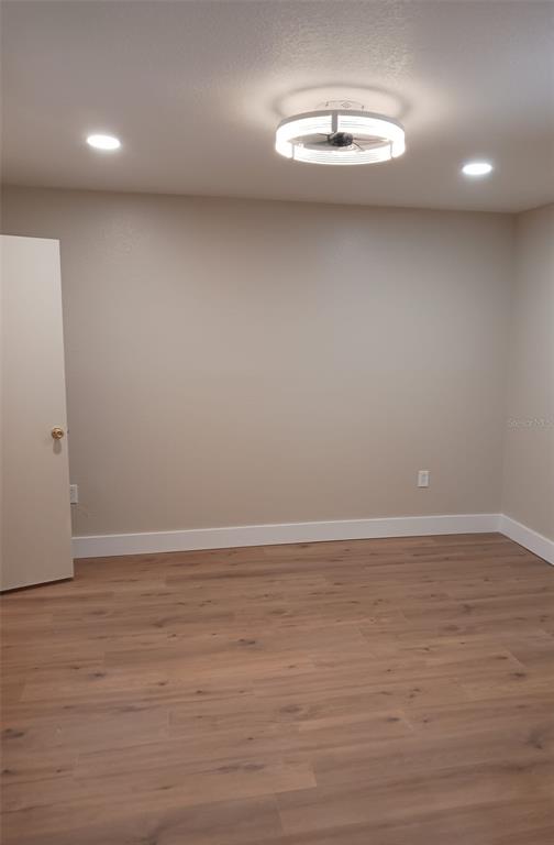 623 Dory Lane, Unit 306 Altamonte Springs, FL 32714 - Photo 17 of 21 wooden floor in an empty room