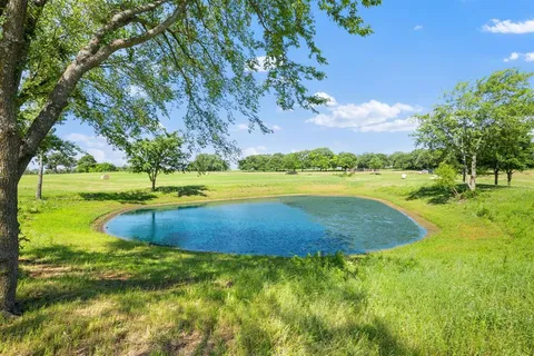 a view of an swimming pool with a yard