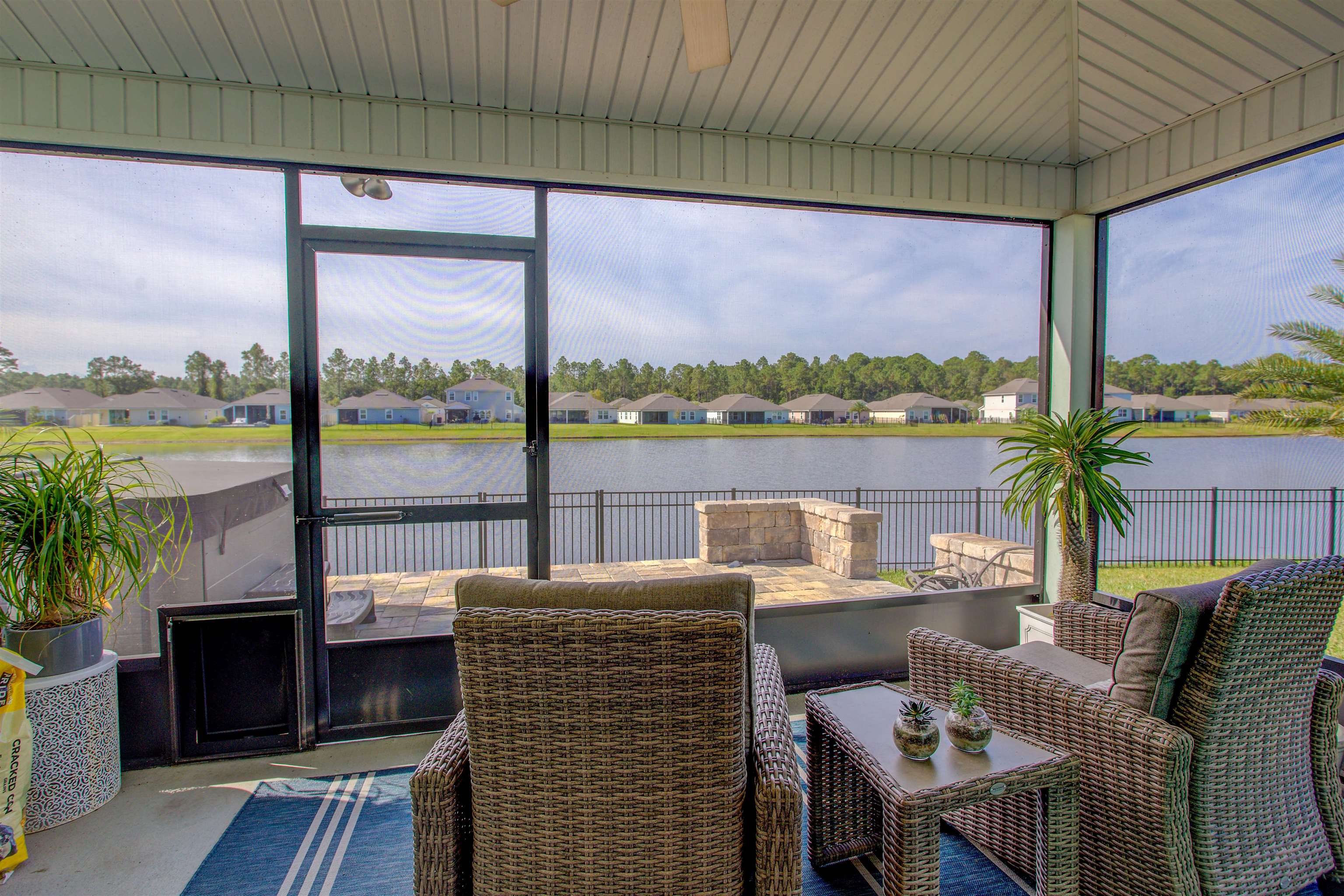 130 Huesca Court St. Augustine, FL 32084 - Photo 11 of 63 a view of a balcony and lake with furniture