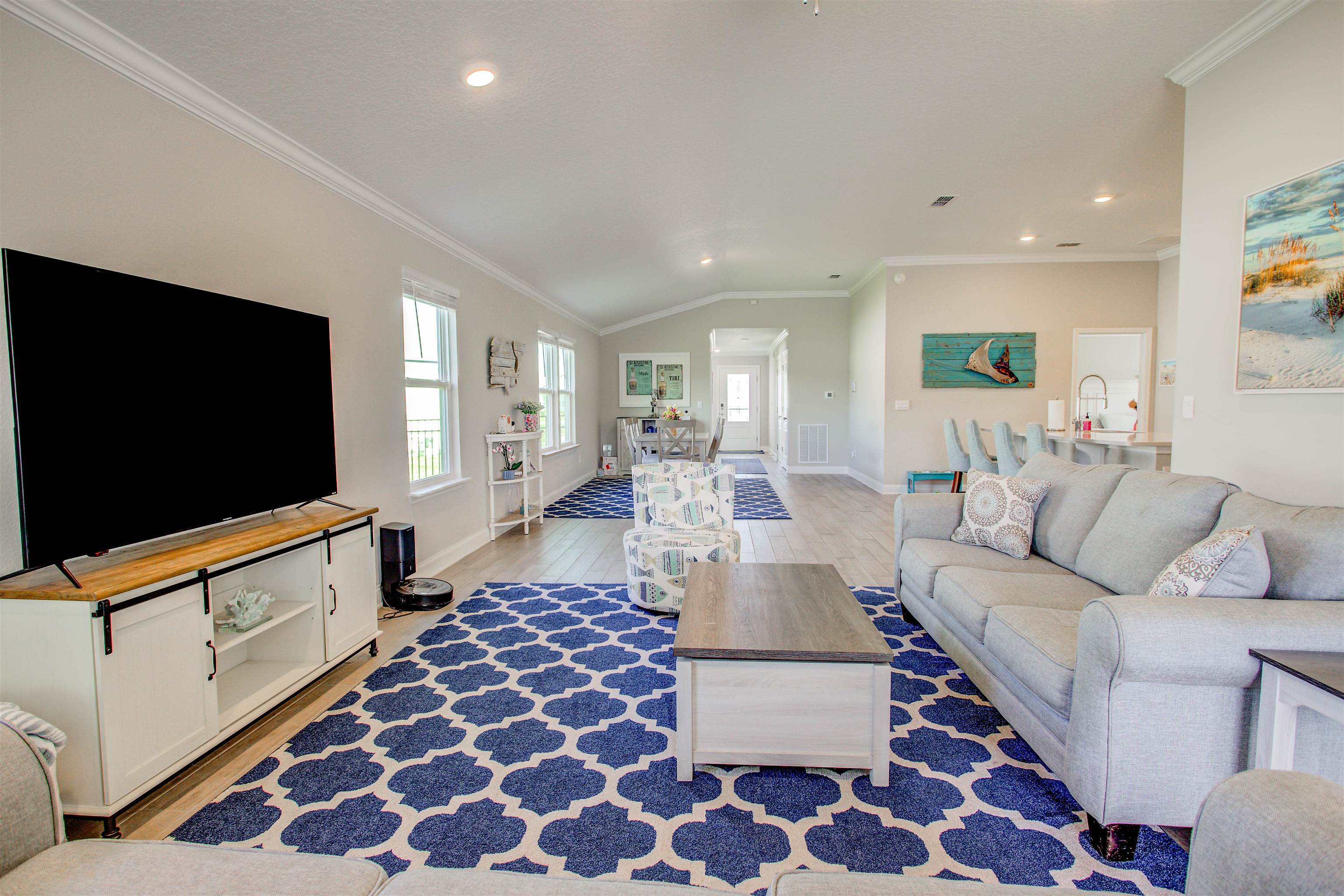 130 Huesca Court St. Augustine, FL 32084 - Photo 13 of 63 a living room with furniture and a flat screen tv