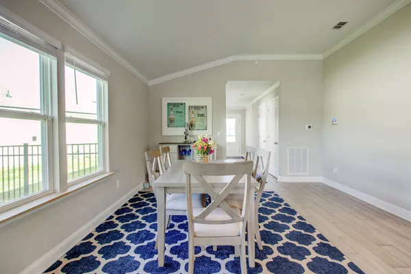 a kitchen with stainless steel appliances a stove a sink a refrigerator a microwave and cabinets