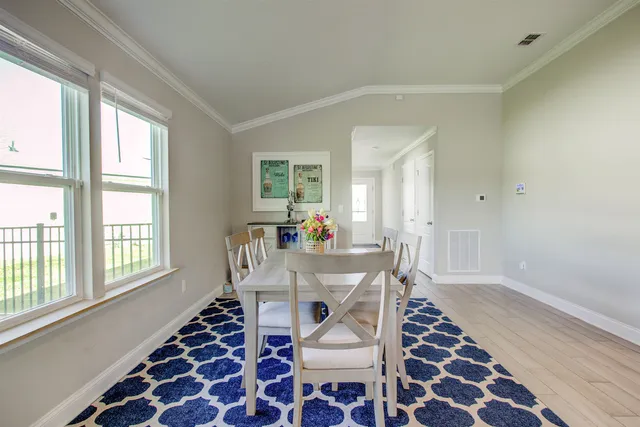 a kitchen with stainless steel appliances a stove a sink a refrigerator a microwave and cabinets