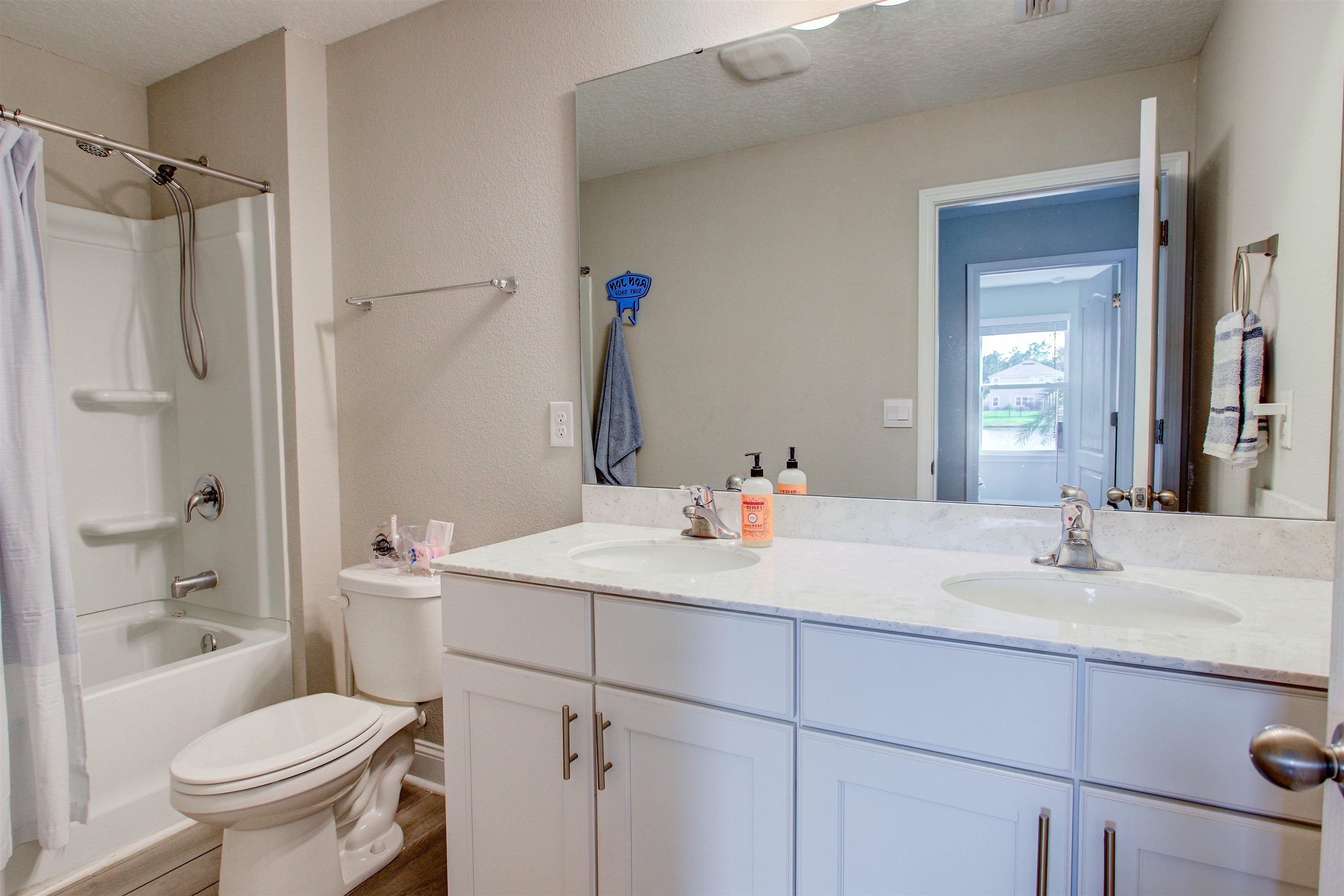 130 Huesca Court St. Augustine, FL 32084 - Photo 30 of 63 a bathroom with a sink toilet vanity and shower