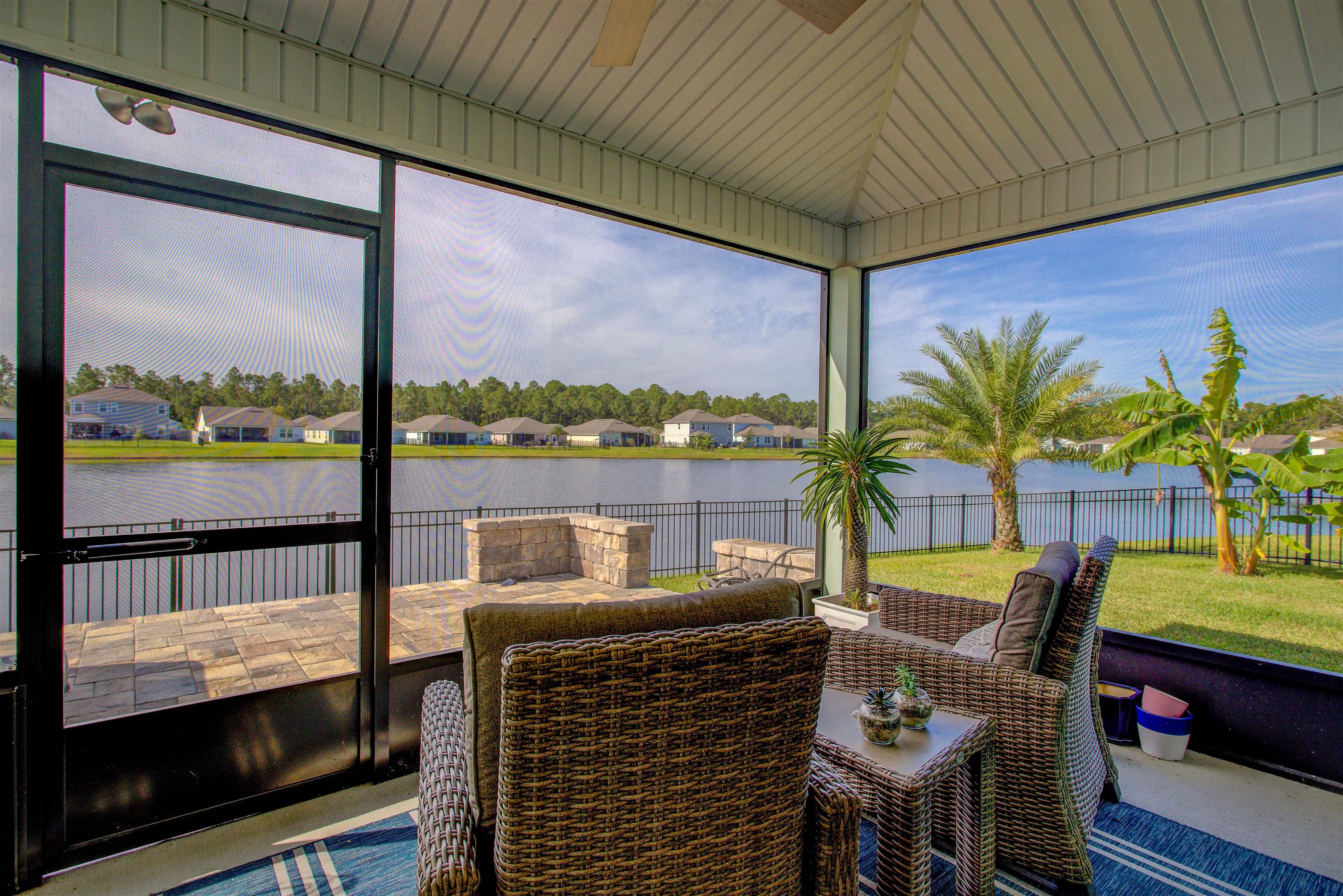 130 Huesca Court St. Augustine, FL 32084 - Photo 31 of 63 a view of a balcony with lake view and a potted plant