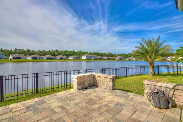 an outdoor space with pool and furniture