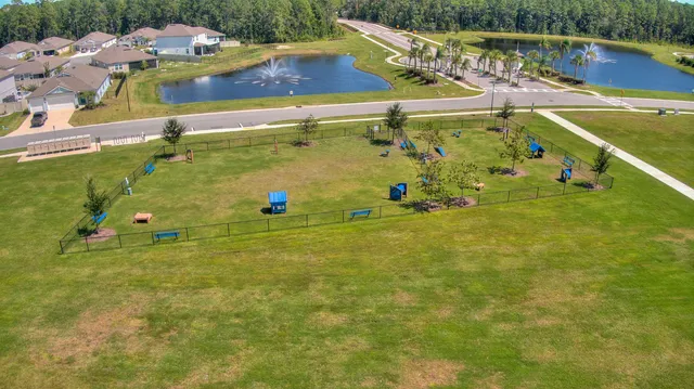 an aerial view of residential houses with outdoor space