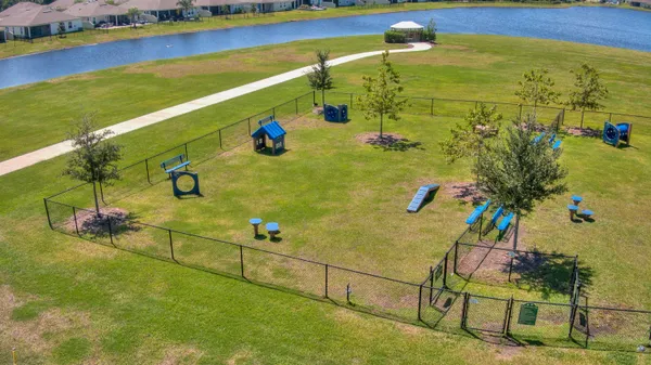 an aerial view of a house swimming pool patio and outdoor seating