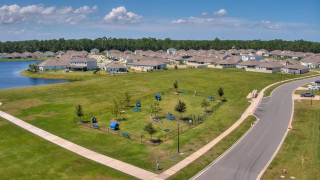 an aerial view of a house with a swimming pool