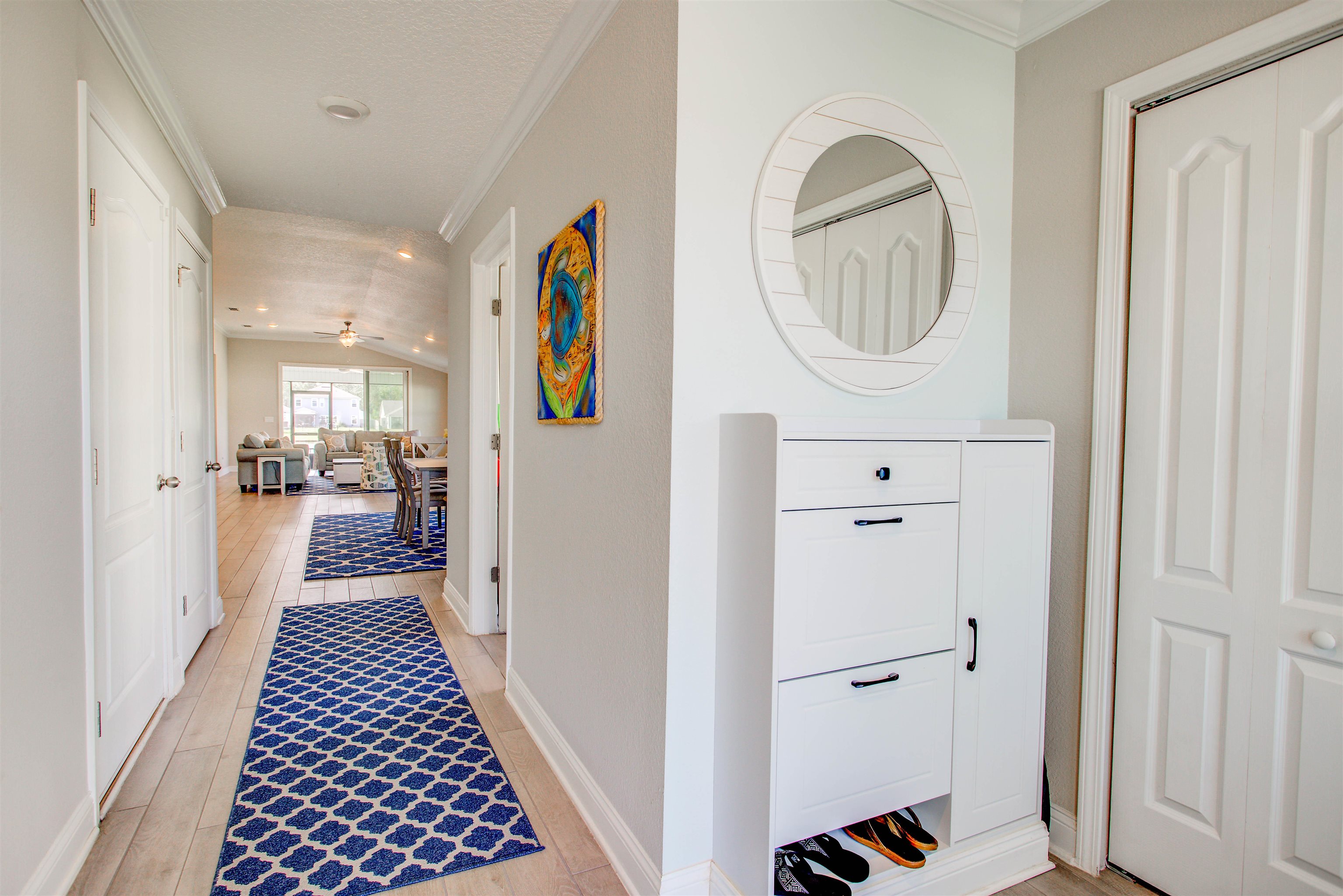 130 Huesca Court St. Augustine, FL 32084 - Photo 5 of 63 Hall with crown molding and light wood finished floors