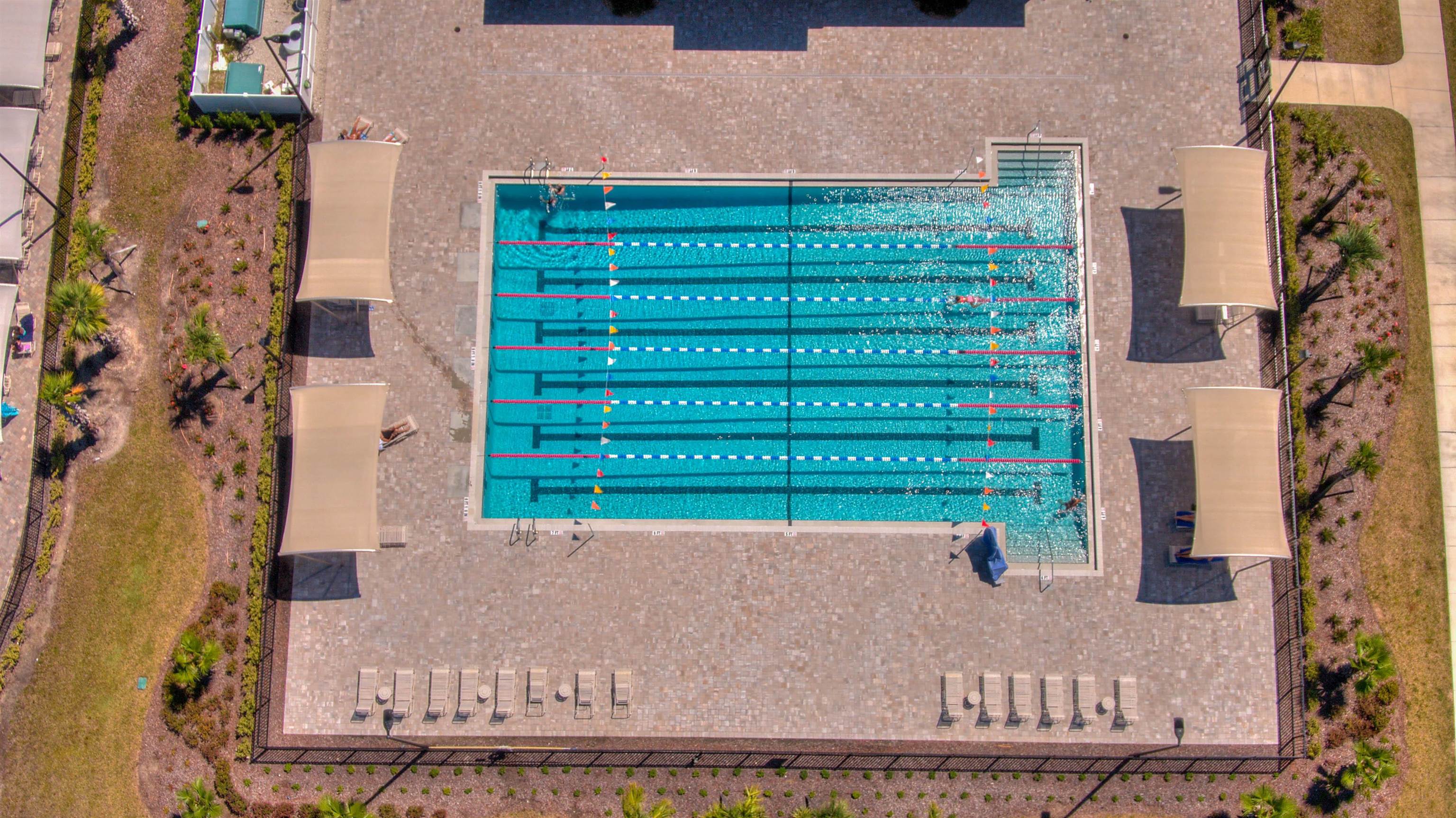 130 Huesca Court St. Augustine, FL 32084 - Photo 58 of 63 front view of a brick house with a yard