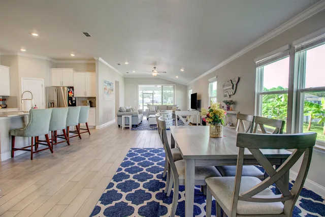 a view of a dining room with furniture and wooden floor