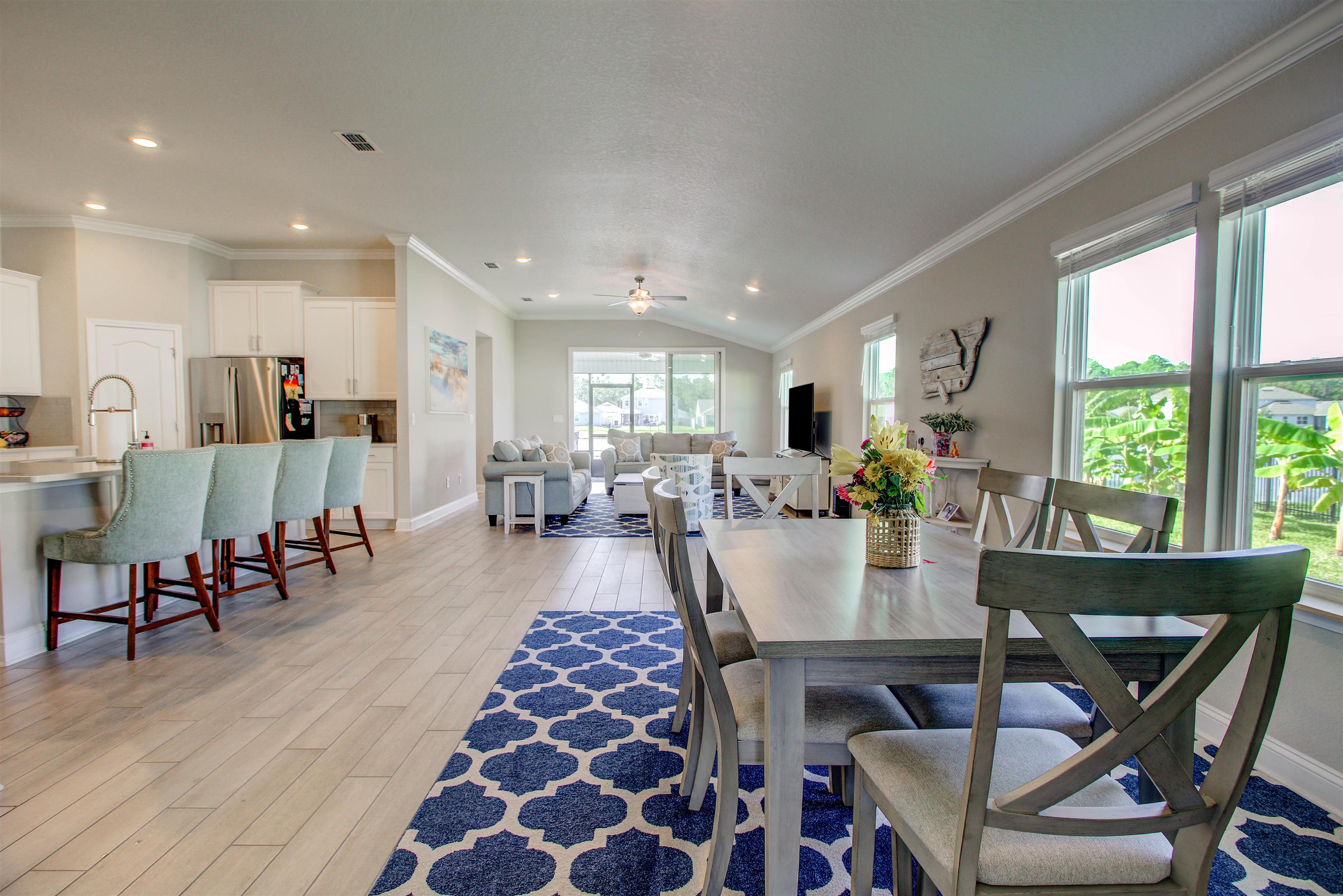 130 Huesca Court St. Augustine, FL 32084 - Photo 7 of 63 a view of a dining area with furniture window and wooden floor