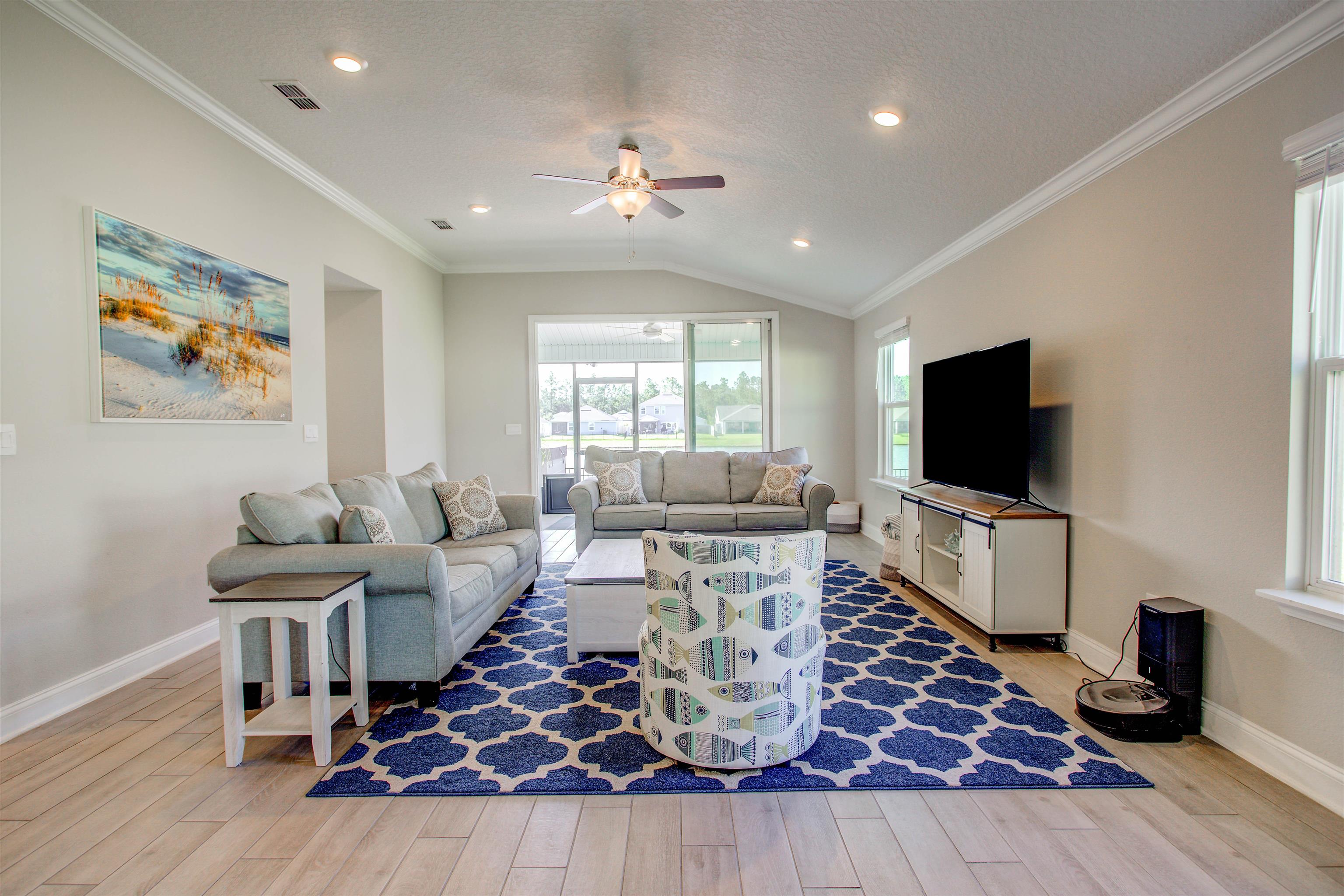 130 Huesca Court St. Augustine, FL 32084 - Photo 9 of 63 a living room with furniture and a flat screen tv