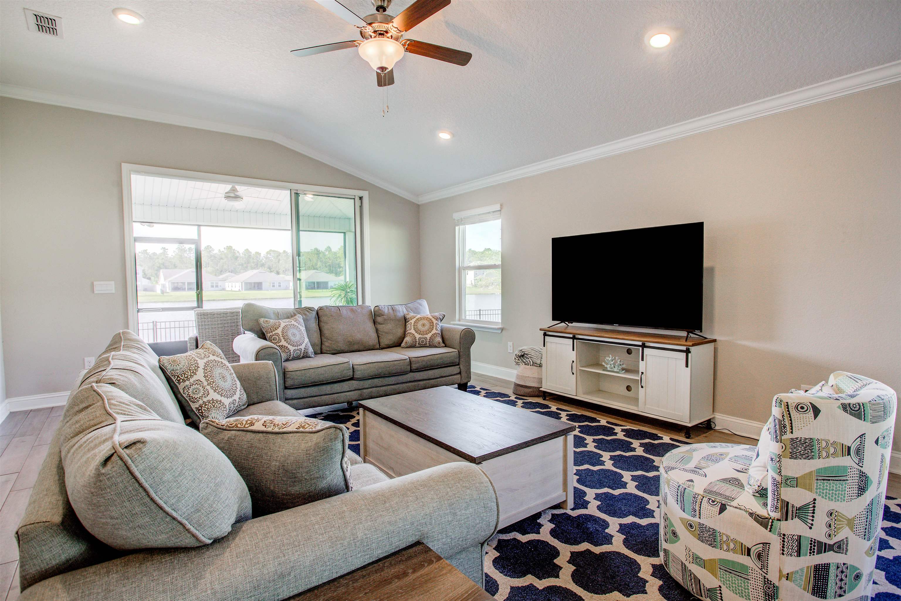 130 Huesca Court St. Augustine, FL 32084 - Photo 10 of 63 a living room with furniture and a flat screen tv