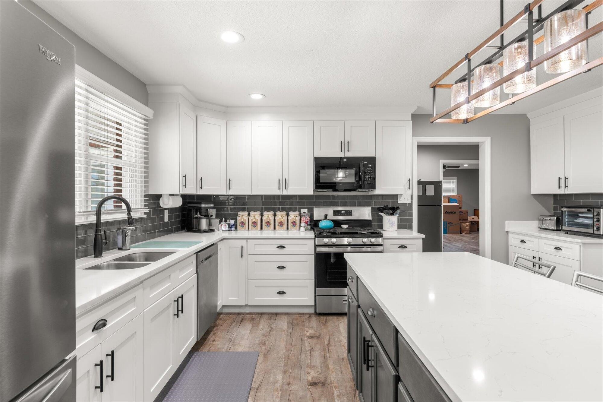 137 County Road 146 Riceville, TN 37370 - Photo 11 of 58 a kitchen with a sink stove top oven and refrigerator