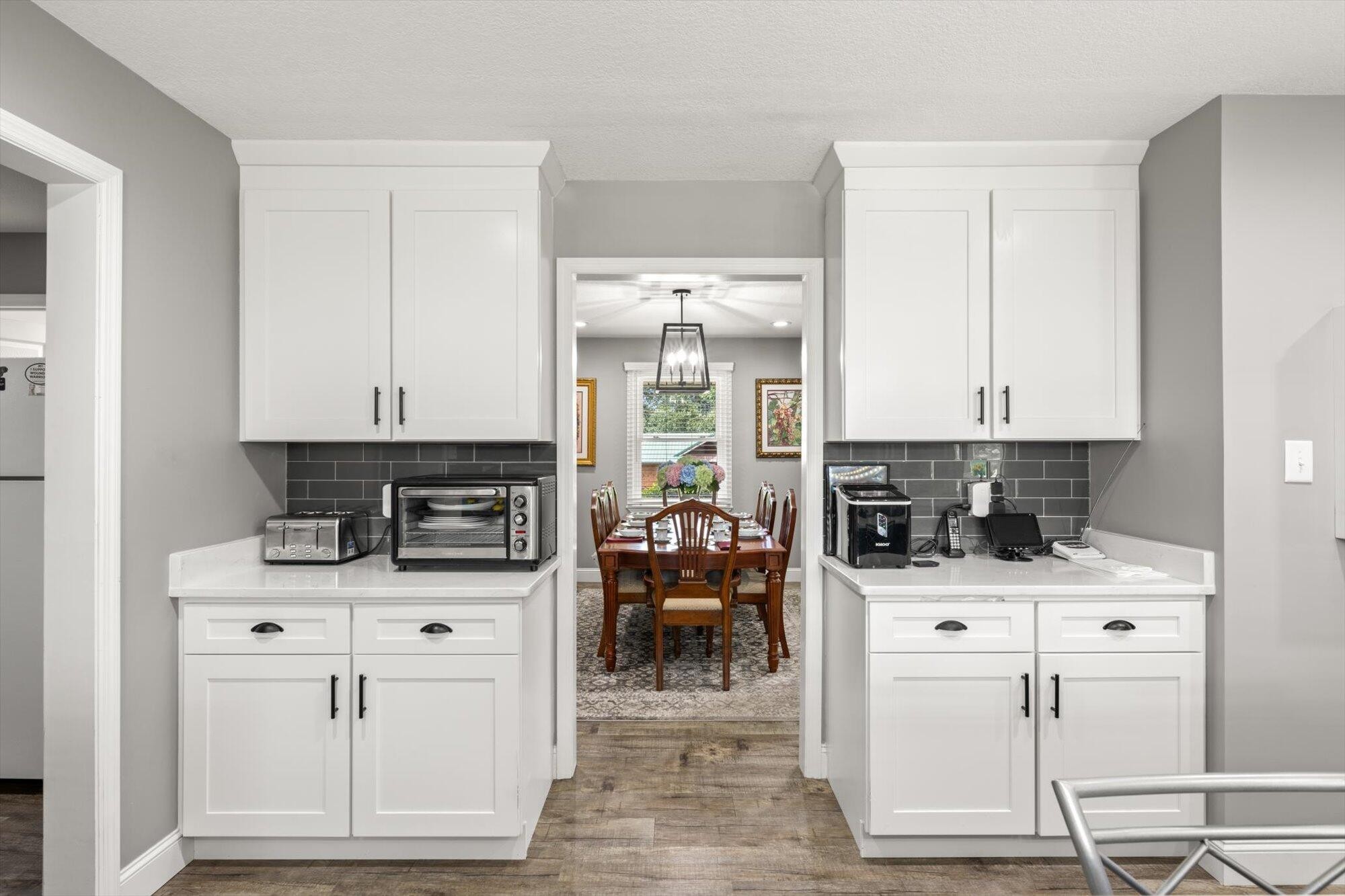 137 County Road 146 Riceville, TN 37370 - Photo 15 of 58 a kitchen with white cabinets and appliances