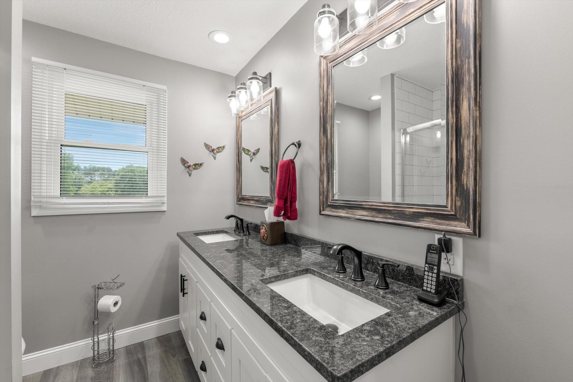 137 County Road 146 Riceville, TN 37370 - Photo 21 of 58 a bathroom with a granite countertop sink and a mirror