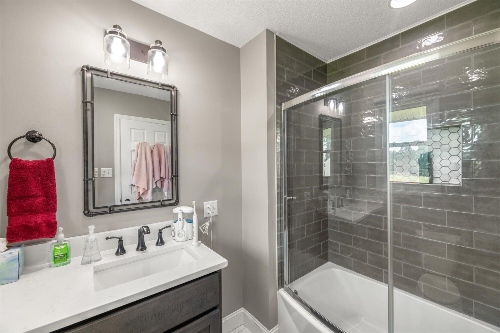 137 County Road 146 Riceville, TN 37370 - Photo 23 of 58 a bathroom with a sink a toilet and shower