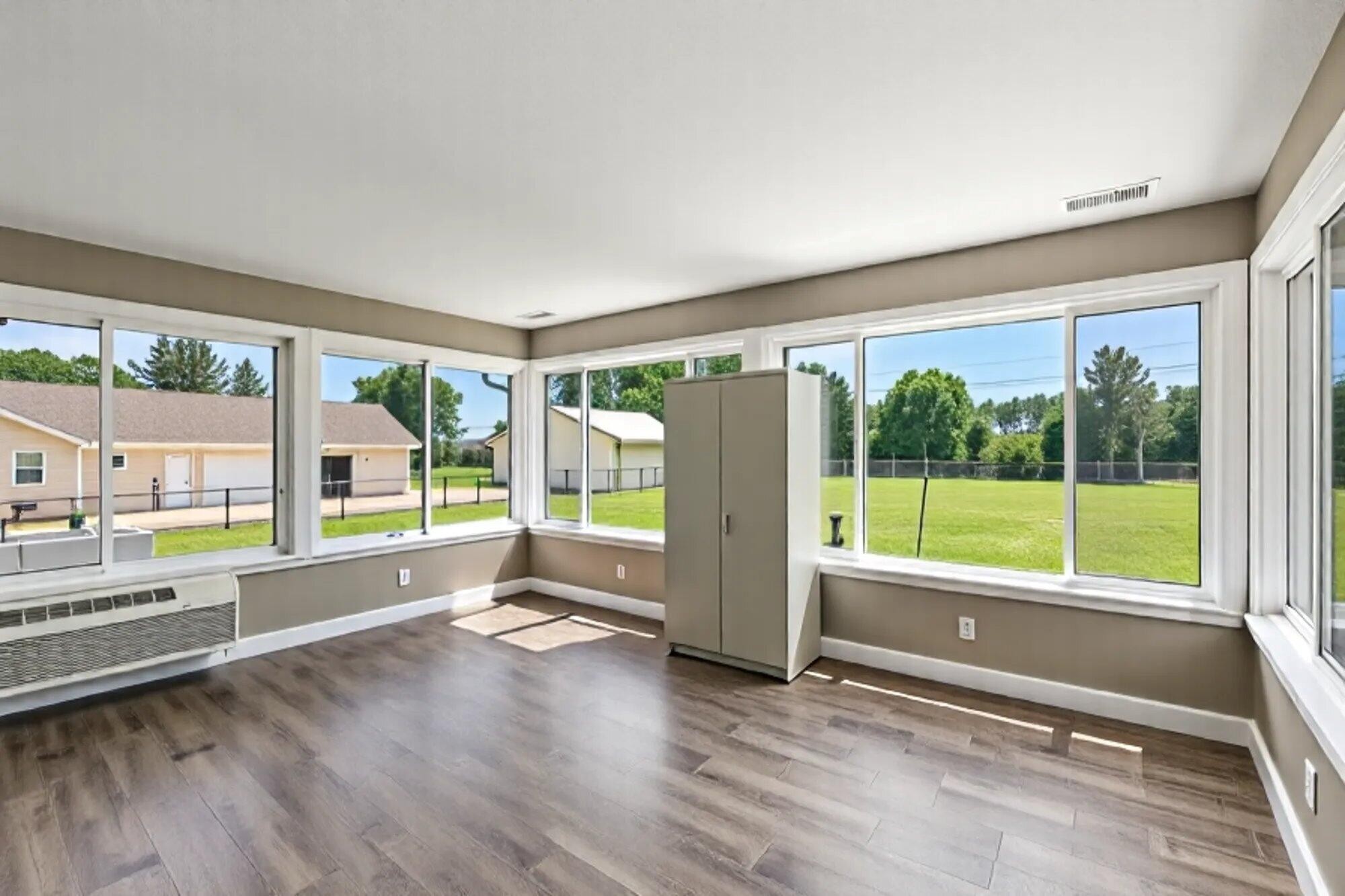 137 County Road 146 Riceville, TN 37370 - Photo 36 of 58 a view of an empty room with wooden floor and a large window