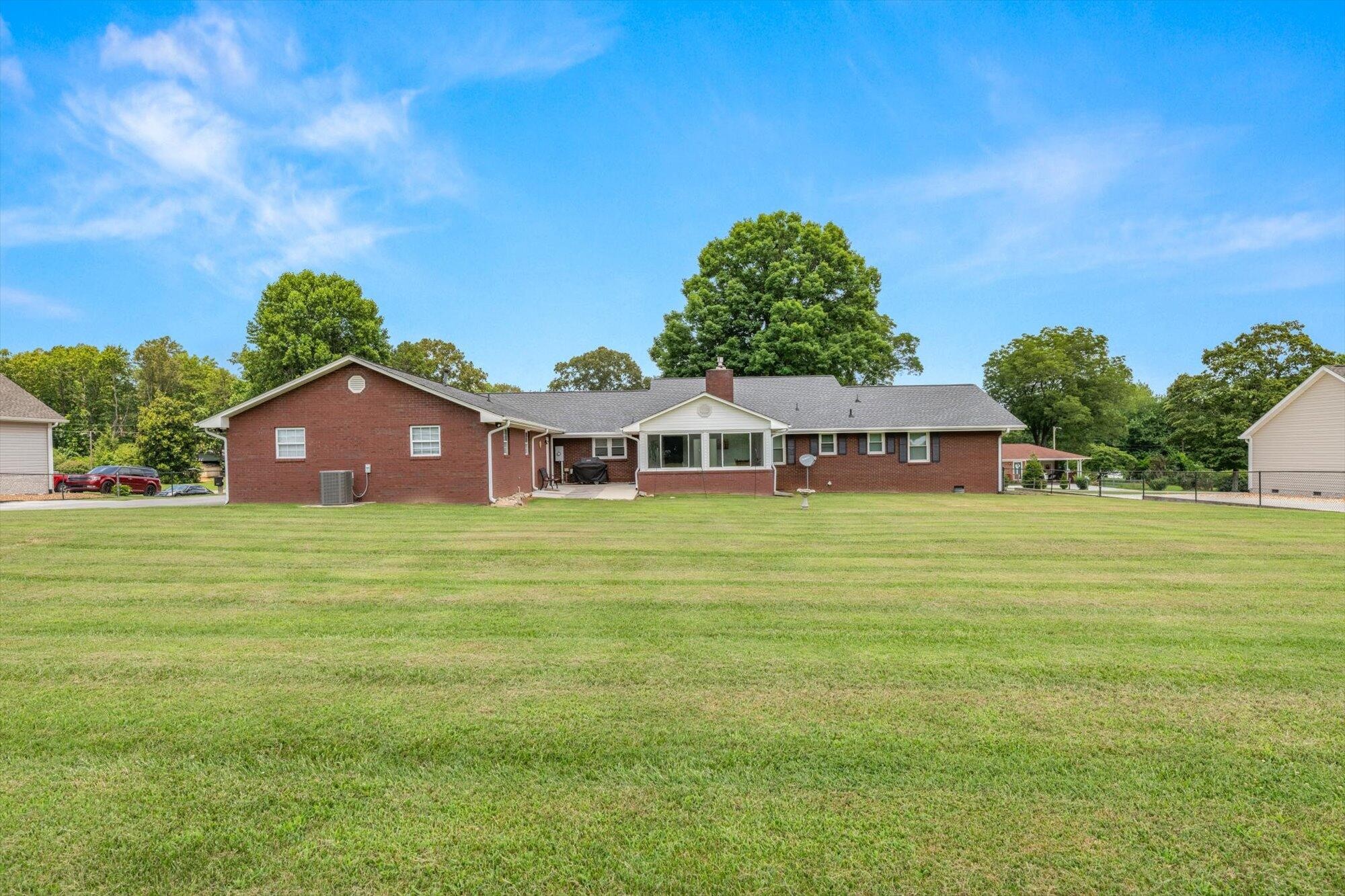 137 County Road 146 Riceville, TN 37370 - Photo 45 of 58 a front view of a house with a garden